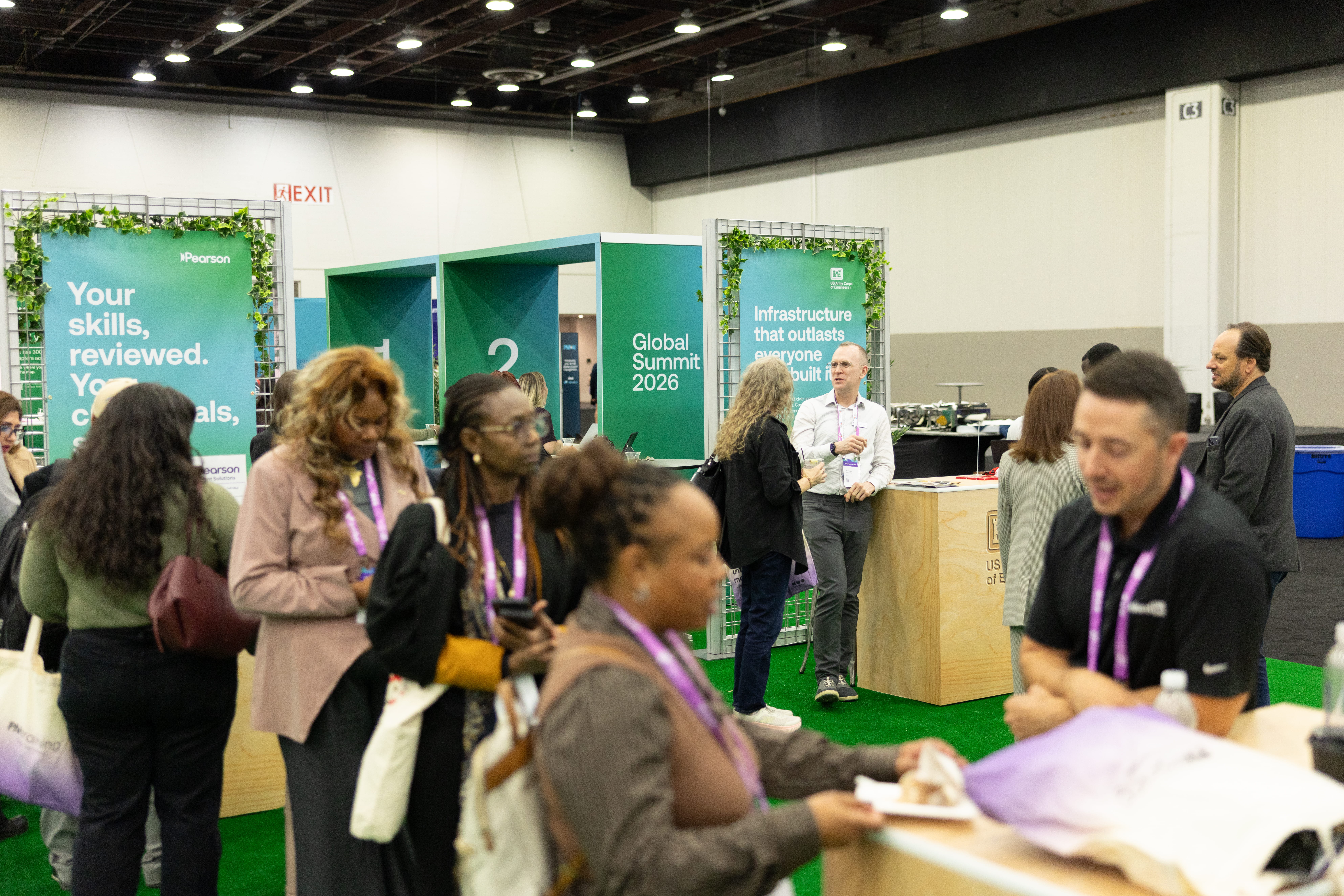 attendees-standing-at-booth