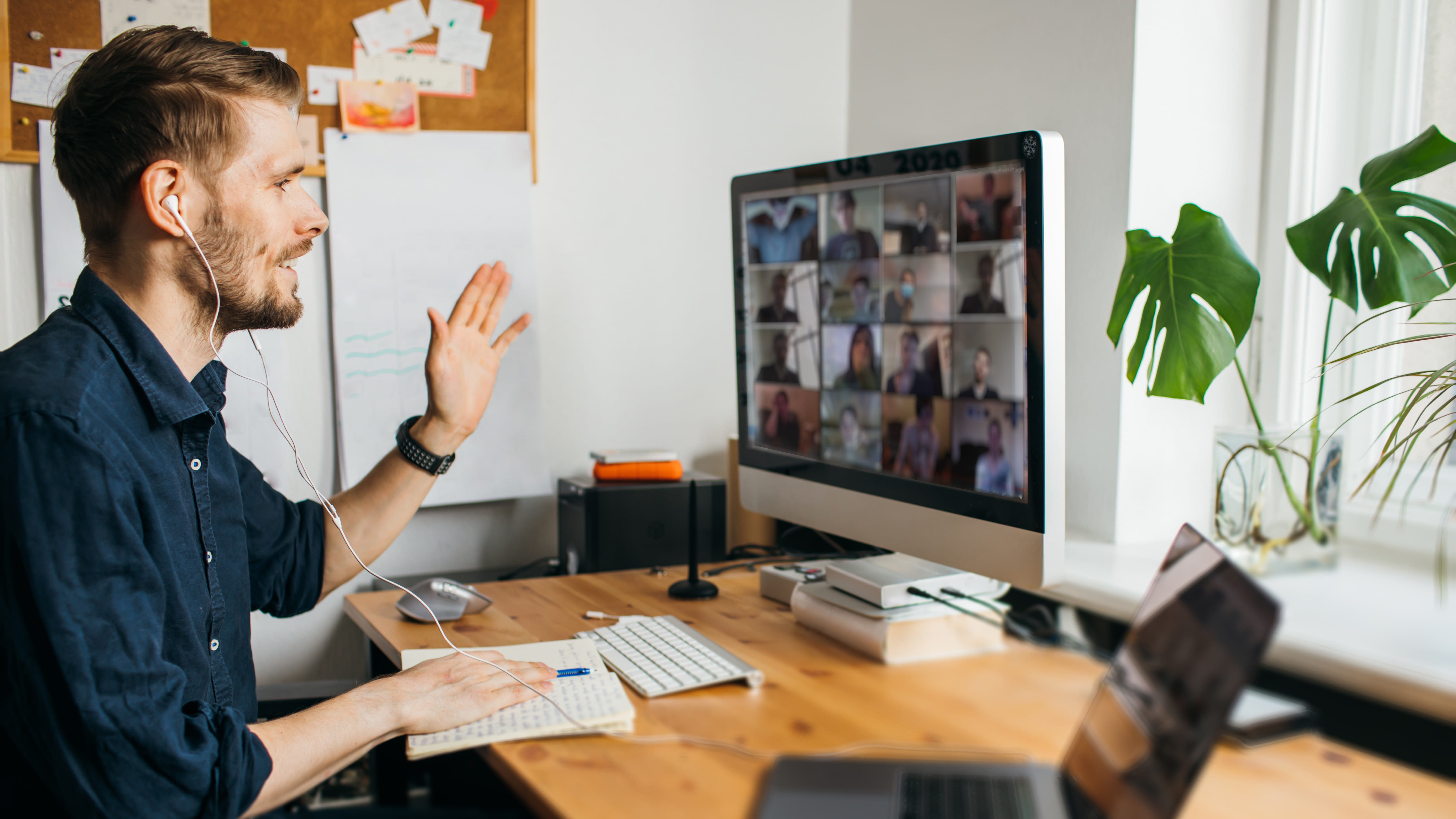 man-sitting-at-desk-on-zoom-call