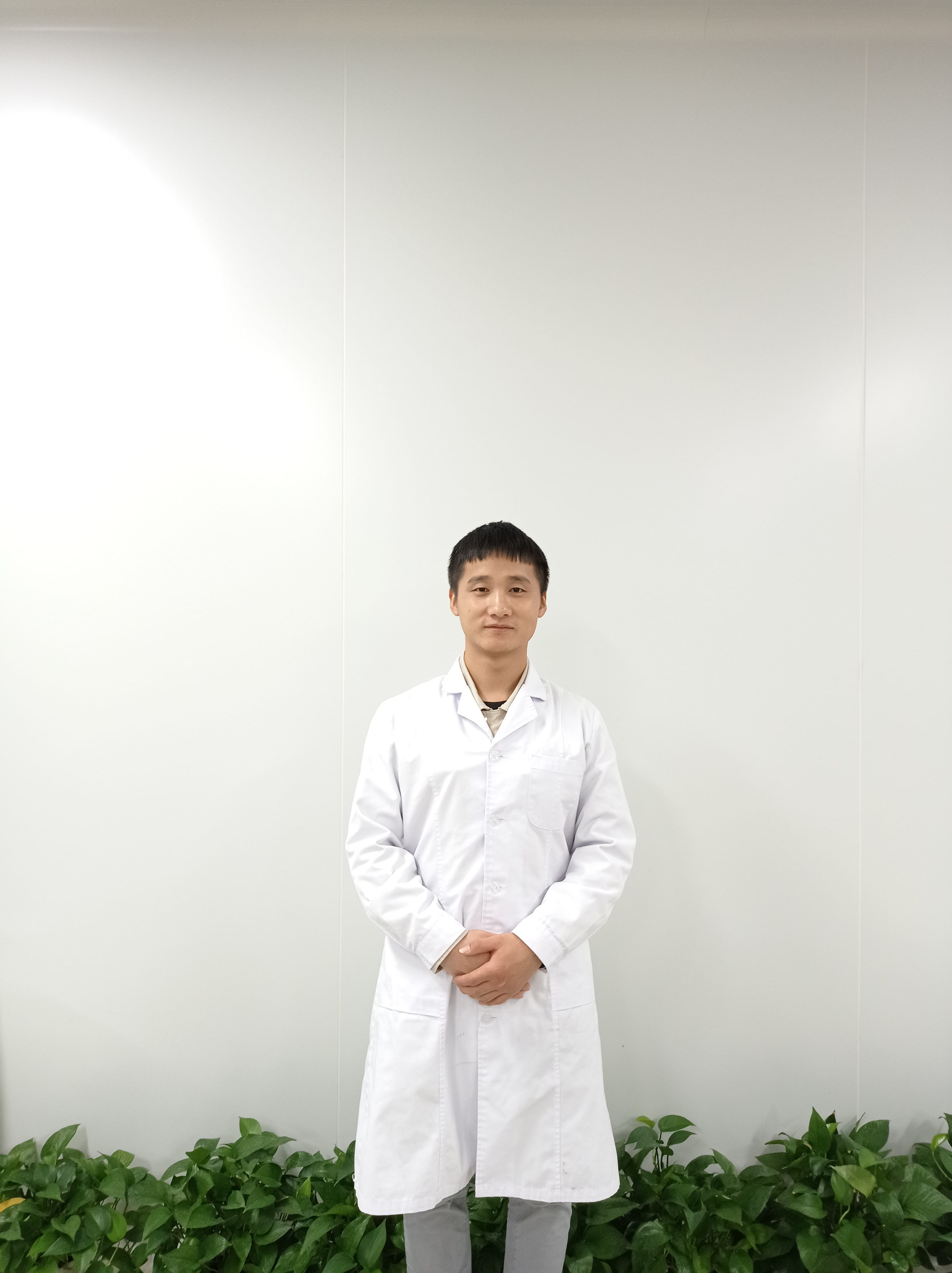 Advancing Chronic Disease Detection: Man standing in white lab coat