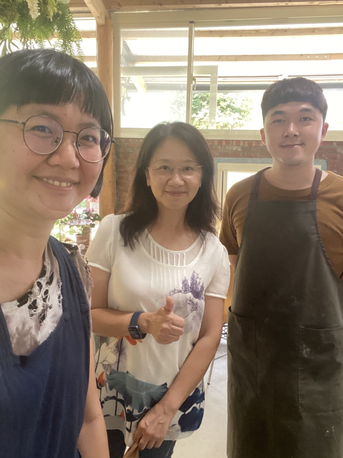 Three smiling people