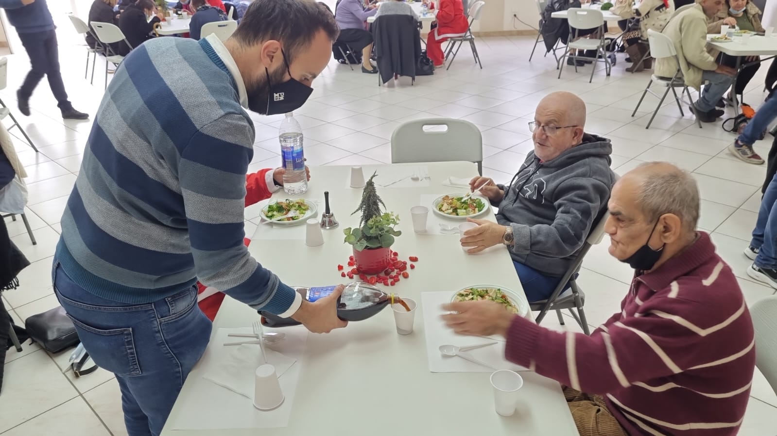 H4I-rebuilding-community-lebanon-men-sitting-at-table