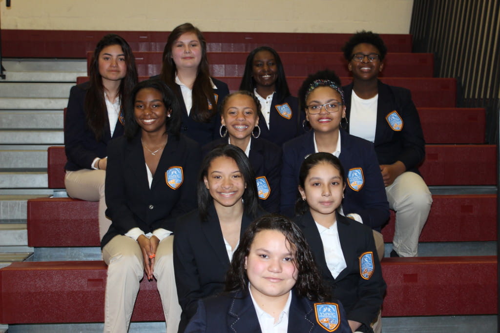 YMWIC-students-sitting-bleachers