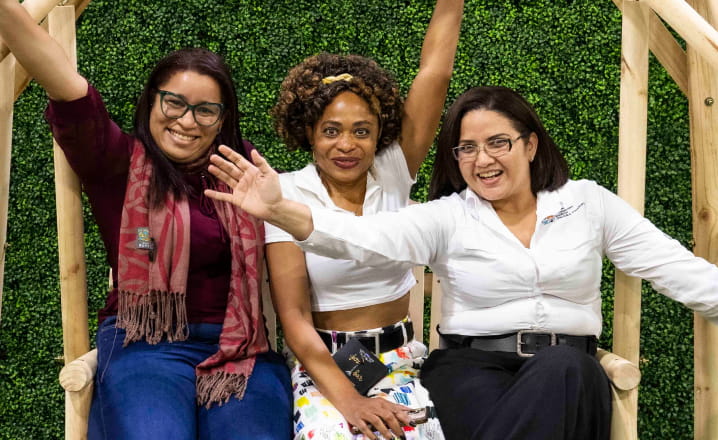 three-women-with-arms-raised