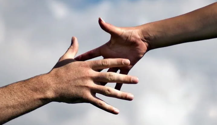 holding-hands-cloud-background