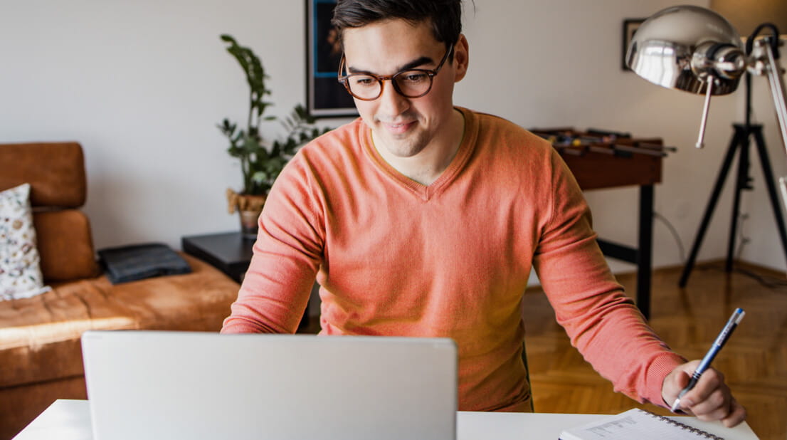 Engaged man working remotely on a laptop