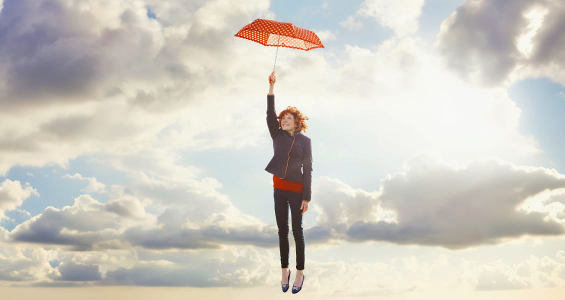 woman-in-sky-holding-red-umbrella