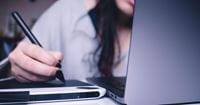 person-holding-pen