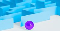 Purple marble entering a blue maze