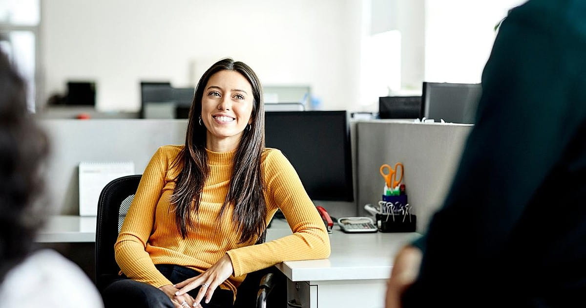 woman-sitting-and-smiling