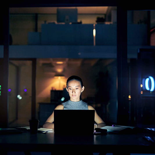 Woman sitting in front of computer